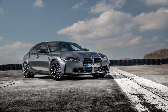 Silver BMW M3 on a Racetrack