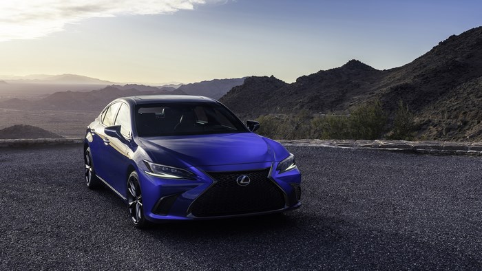 Blue Lexus ES F Sport parked in a rocky landscape