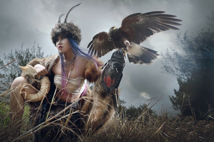 Asian woman with a hawk and ram skull