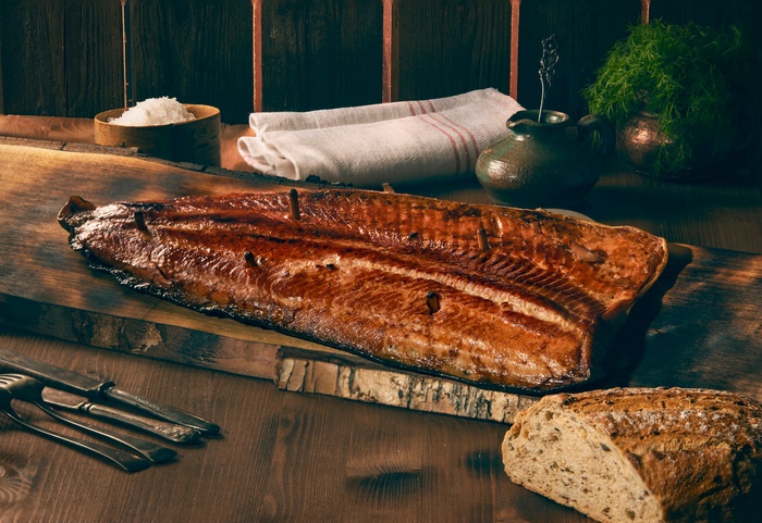 Smoked Salmon on a Wooden Board with Bread