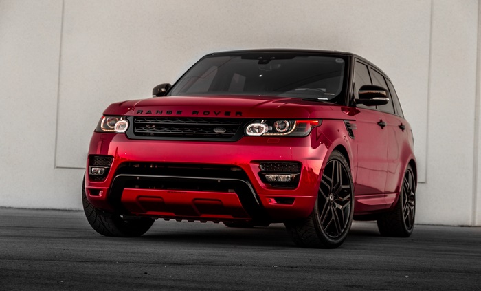 Red Range Rover Sport SUV parked outdoors