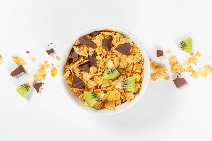 Bowl of cereal with chocolate and kiwi