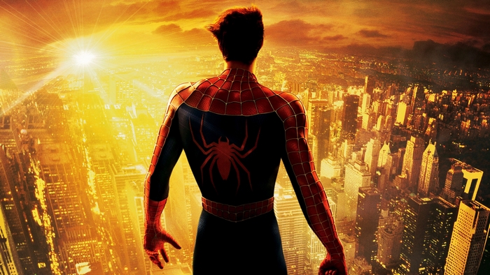 Spider-Man overlooking a city at sunset