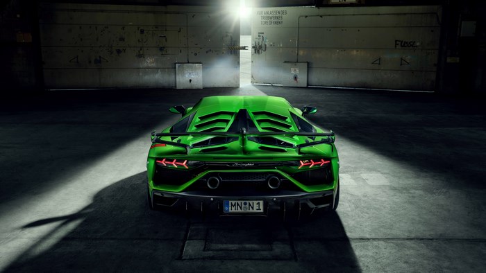 Green Lamborghini Aventador SVJ in a Garage