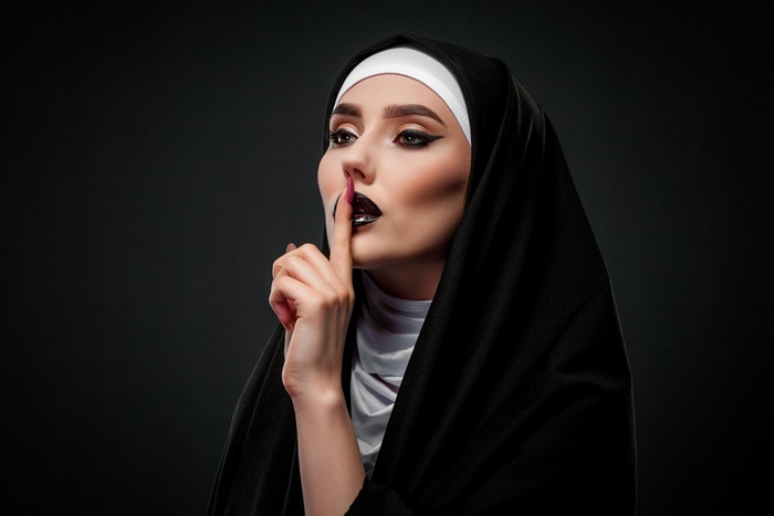 Portrait of a Woman Dressed as a Nun with Dark Makeup