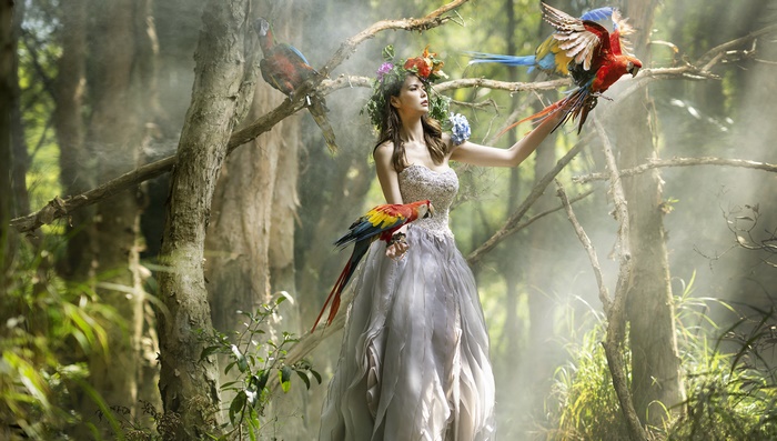 Asian Woman in Forest with Parrots