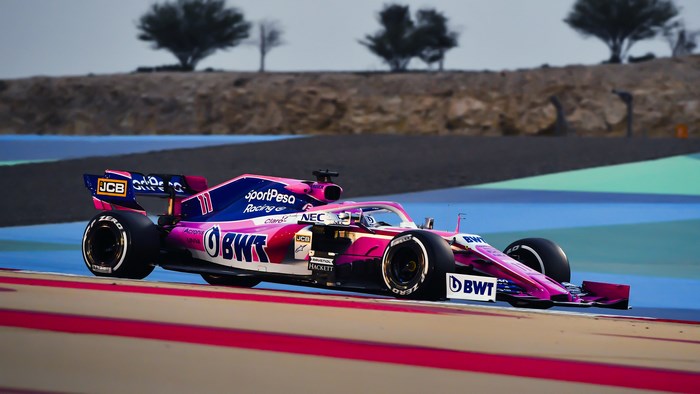 Pink Formula 1 Car Racing on Track