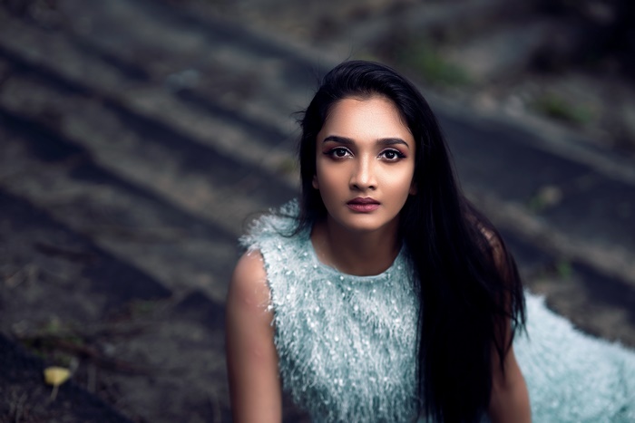 Woman with black hair and brown eyes