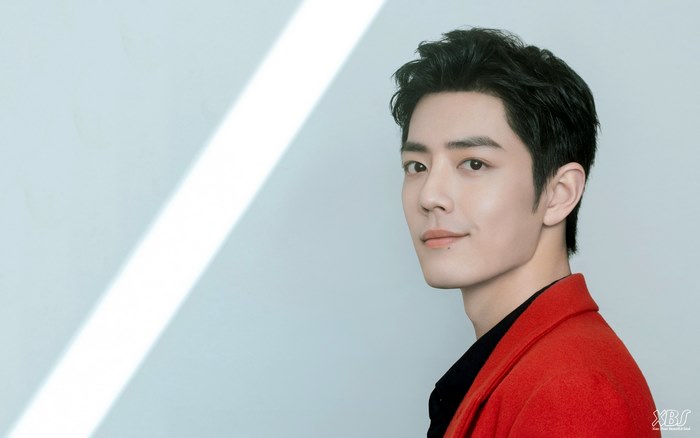 Xiao Zhan in a red jacket