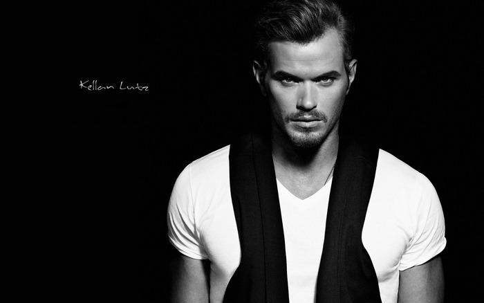 Kellan Lutz in a white t-shirt and vest