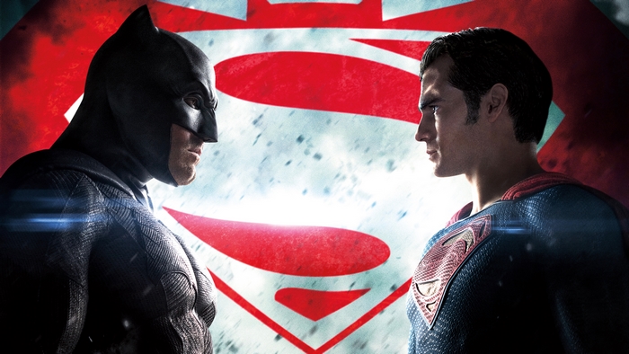 Batman and Superman face off in front of a large S logo