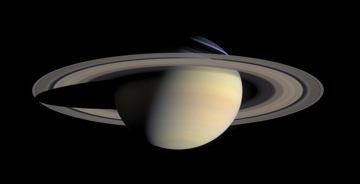 Saturn and its rings casting a shadow