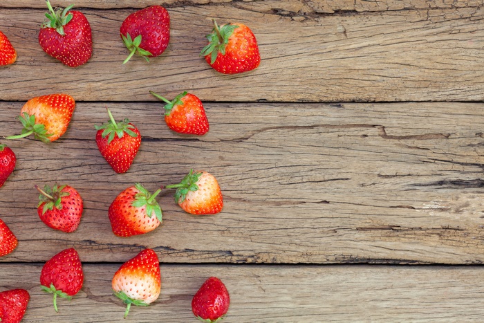 Strawberries on a wooden surface