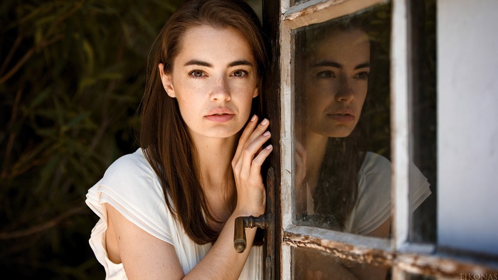 Woman with Brunette Hair Reflected in a Window