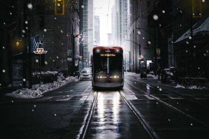 Red tram on a snowy street in Toronto