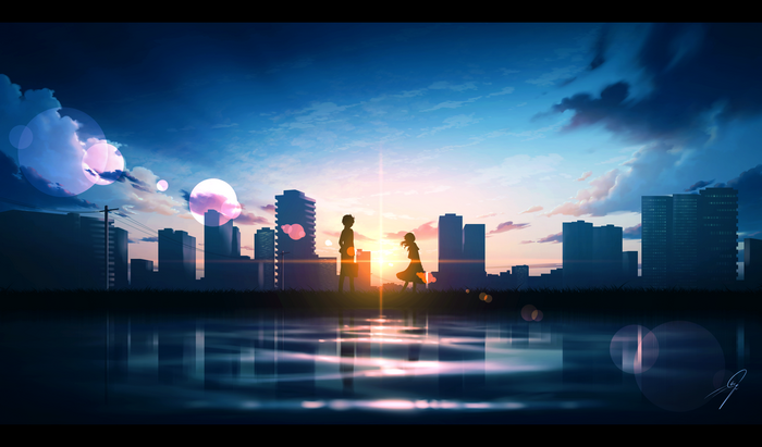 Couple silhouetted against a sunset cityscape reflection