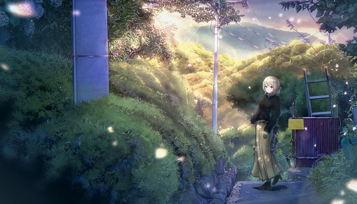 Girl standing on a path with trees and mountains