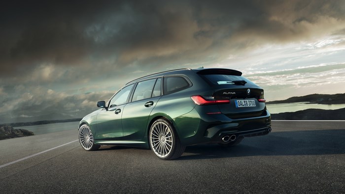 Green BMW Alpina B3 Touring car on a road