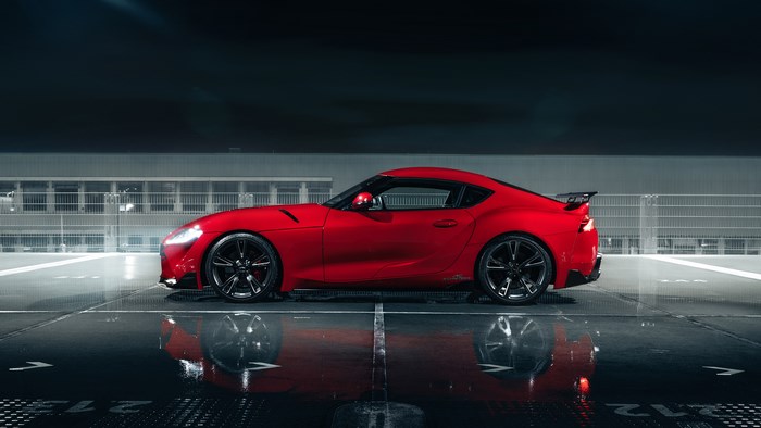 Red Toyota GR Supra parked at night