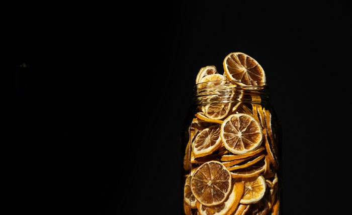 Glass jar filled with dried lemon slices