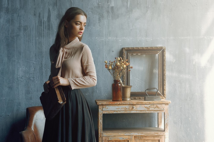 Woman with book and dried flowers