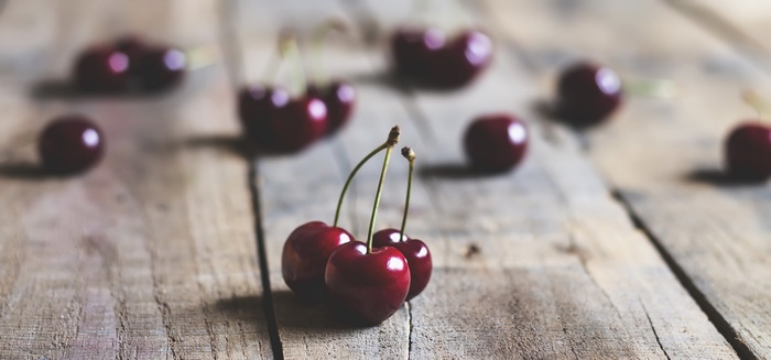 Cherries on a wooden surface