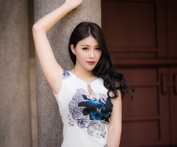 Asian Woman with Black Hair Wearing a Floral Dress