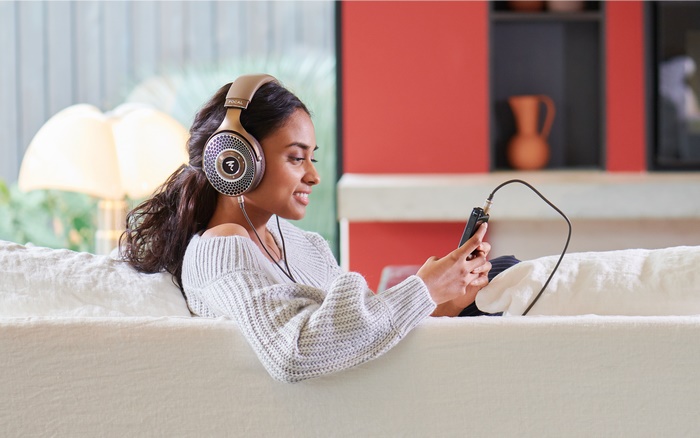 Woman wearing Focal headphones listening to music