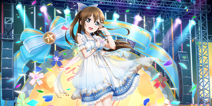 Shizuku Osaka performs on a stage with blue ribbons and confetti