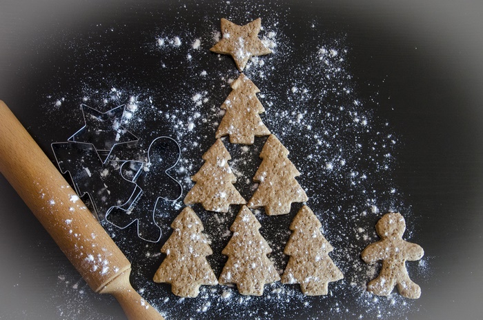 Christmas cookies arranged in a tree shape with cookie cutters