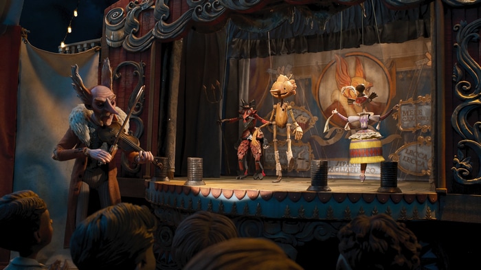 Pinocchio puppet show with a violinist
