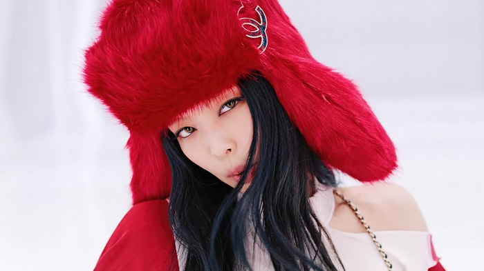 Jennie from BLACKPINK wearing a red furry hat