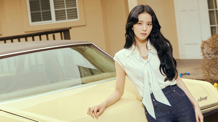 Jisoo poses by a vintage car