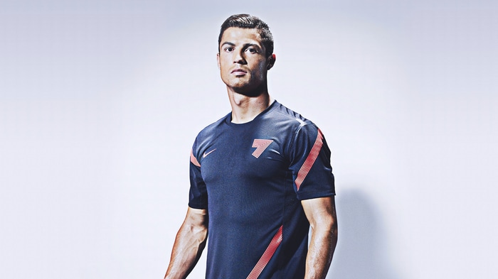 Cristiano Ronaldo in a dark blue shirt with red accents