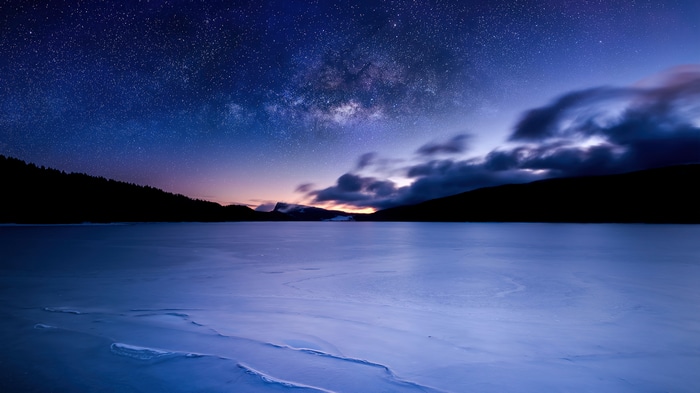 Milky Way over a frozen lake in Switzerland