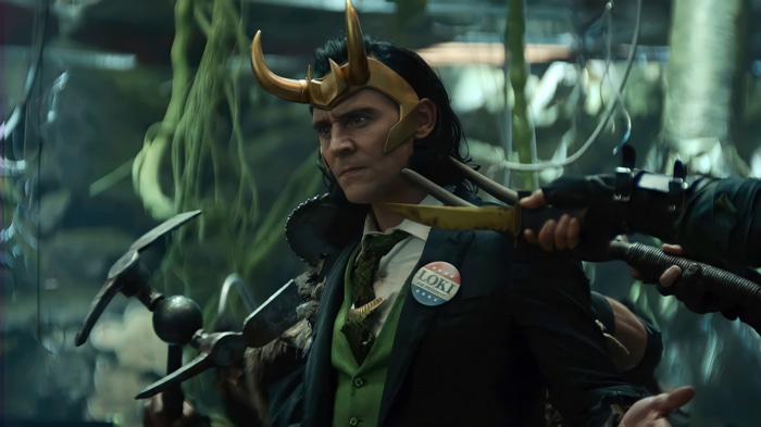 Loki in a suit with a Loki for President pin