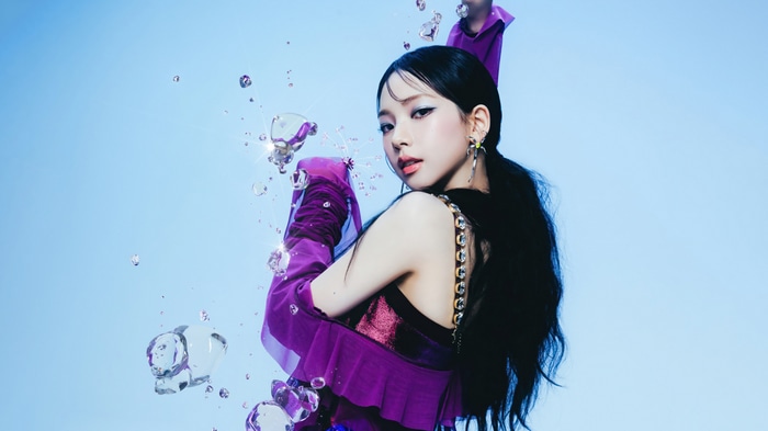 Karina from Aespa in purple outfit with water bubbles