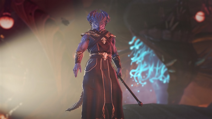 Dragonborn character in dark robes holding a staff