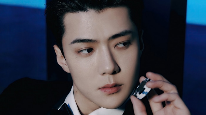 Sehun of EXO holding a poker chip