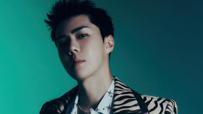 Sehun from EXO in a zebra print jacket