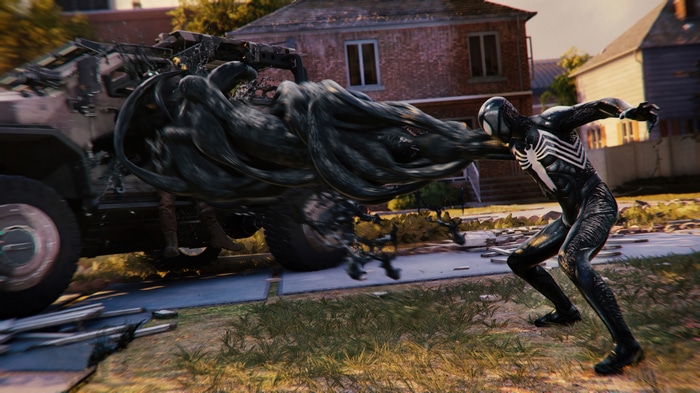 Spider-Man in Black Suit Fighting a Black Goo Monster