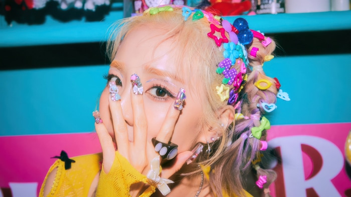 Sandara Park with colorful hair clips and nails