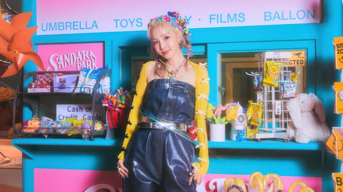Sandara Park in a colorful candy store setting