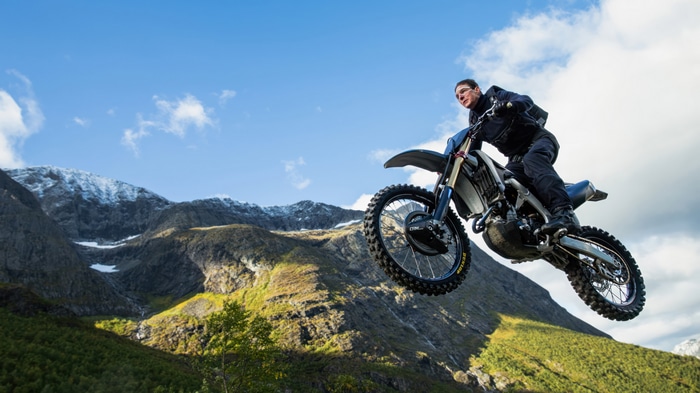 Tom Cruise performs a motorcycle stunt in Mission: Impossible 4K