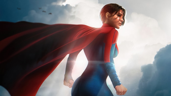 Supergirl in a red and blue suit with a red cape