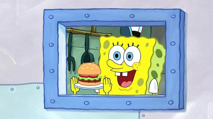 SpongeBob SquarePants holding a Krabby Patty