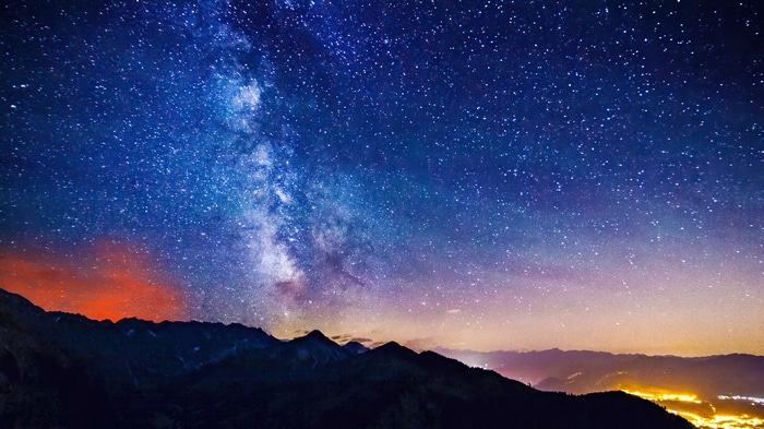 Milky Way Over Mountains at Night 4K