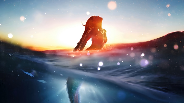 Ariel in the ocean at sunset 4K