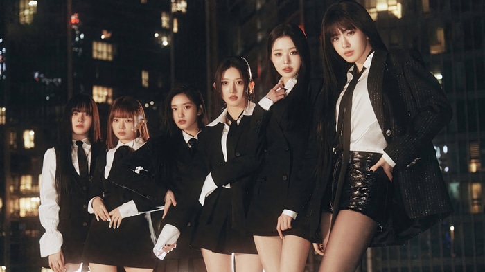 IVE members in black suits at night