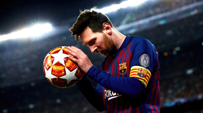 Lionel Messi holding a football
